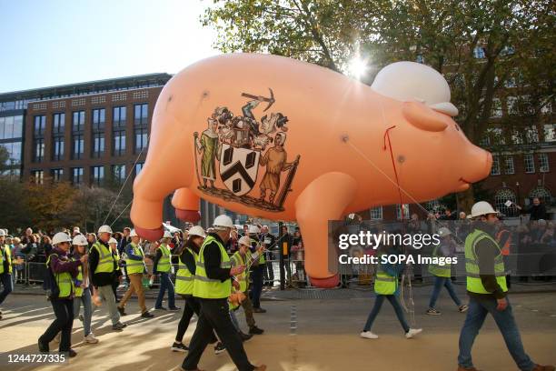 People with an inflatable pig take part during the parade at the Lord Mayor's Show. The show honours the new Lord Mayor, Nicholas Lyons, the 694th...