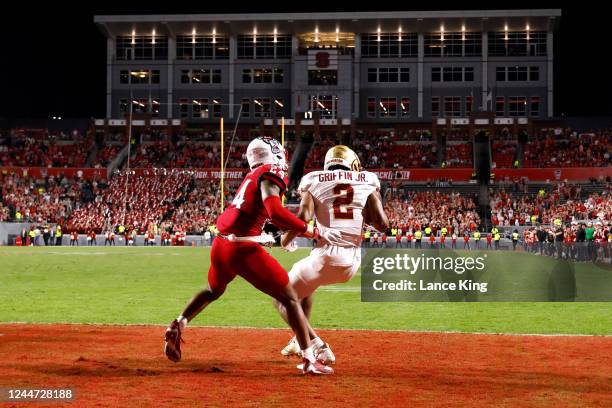 Joseph Griffin Jr. #2 of the Boston College Eagles catches a pass for a 2-yard touchdown against Derrek Pitts Jr. #24 of the North Carolina State...
