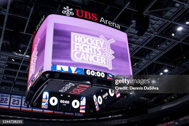 Hockey Fights Cancer logo on display before the game between the New York Islanders and the Columbus Blue Jackets at UBS Arena on November 12, 2022...