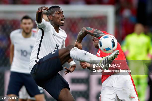 Paul Pogba of France, Valon Behrami of Switzerland during the EURO match between Switzerland v France on June 19, 2016