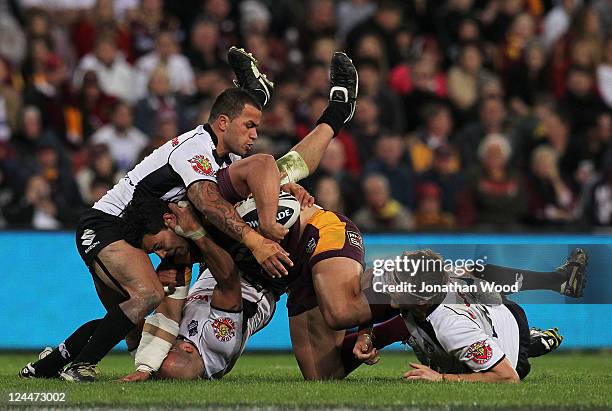 Ben Te'o of the Broncos is tackled during the NRL 2nd Qualifying Final match between the Brisbane Broncos and the Warriors at Suncorp Stadium on...