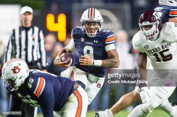 Quarterback Robby Ashford of the Auburn Tigers runs the ball through traffic during the first half of their game against the Texas A&M Aggies at...