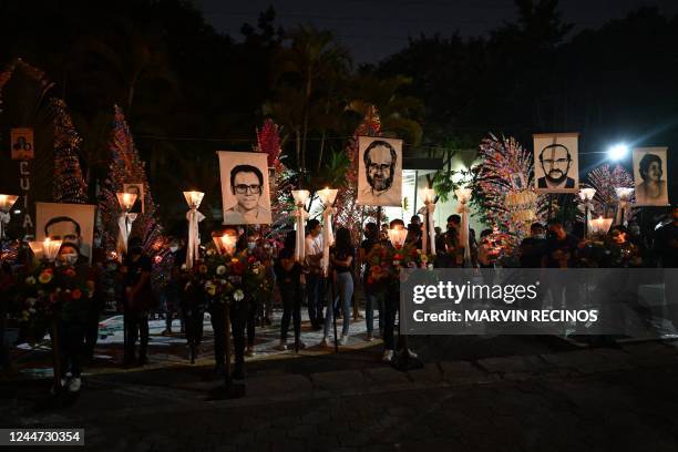 Catholic faithfuls participate in a procession to commemorate the 33th anniversary of the murder of Father Ignacio Ellacuria, five Jesuits priests...