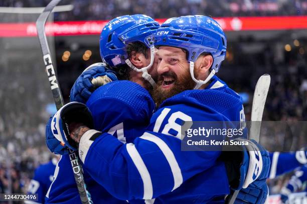 Jordie Benn of the Toronto Maple Leafs celebrates his goal against the Vancouver Canucks with teammate Auston Matthews during the second period at...