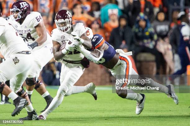 Linebacker Derick Hall of the Auburn Tigers attempts to tackle running back Le'Veon Moss of the Texas A&M Aggies during the first half of play at...