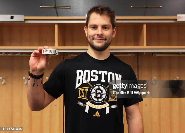 Jakub Zboril of the Boston Bruins holds the puck from his first NHL goal, the game winner, scored against the Buffalo Sabres during a game on...