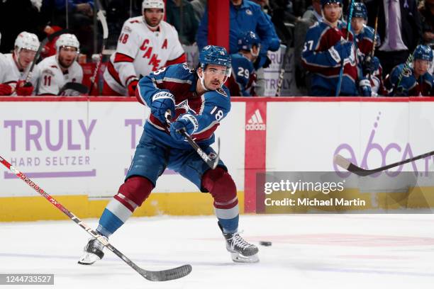 Alex Newhook of the Colorado Avalanche makes a pass against the Carolina Hurricanes at Ball Arena on November 12, 2022 in Denver, Colorado.