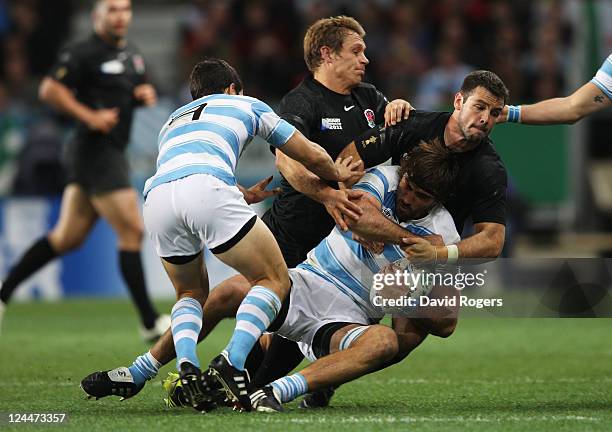 Juan Martin Fernandez Lobbe of Argentina is tackled by Ben Foden of England during the IRB 2011 Rugby World Cup Pool B match between Argentina and...