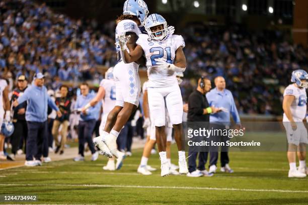 Elijah Green of the North Carolina Tar Heels celebrates after scoring a touchdown during a football game between the Wake Forest Demon Deacons and...