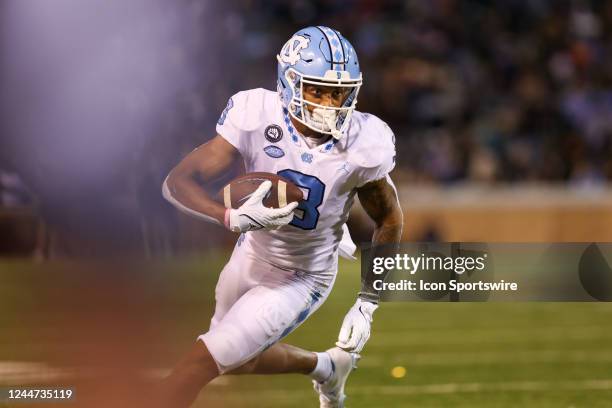 Antoine Green of the North Carolina Tar Heels rums the ball after making a catch during a football game between the Wake Forest Demon Deacons and the...