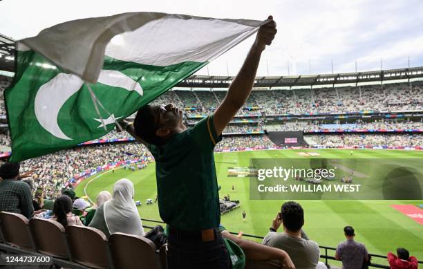 Pakistan supporter waves the national flag ahead of the ICC men's Twenty20 World Cup 2022 final cricket match England and Pakistan at The Melbourne...