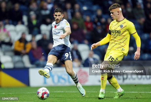 Preston North End's Ched Evans with a thwarted second half effort on goal under pressure from Millwall's Charlie Cresswell during the Sky Bet...