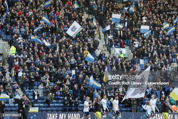 Preston North End fans wave banners and flags as they welcome their side onto the pitch ahead of kick-off during the Sky Bet Championship between...
