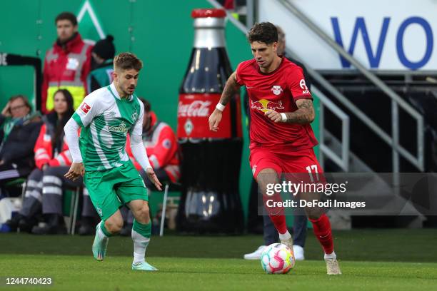 Romano Schmid of SV Werder Bremen and Dominik Szoboszlai of RB Leipzig battle for the Ball during the Bundesliga match between SV Werder Bremen and...