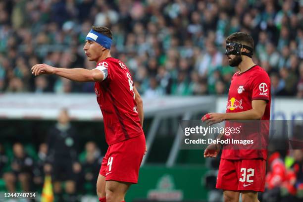 Willi Orban of RB Leipzig and Josko Gvardiol of RB Leipzig gestures during the Bundesliga match between SV Werder Bremen and RB Leipzig at Wohninvest...