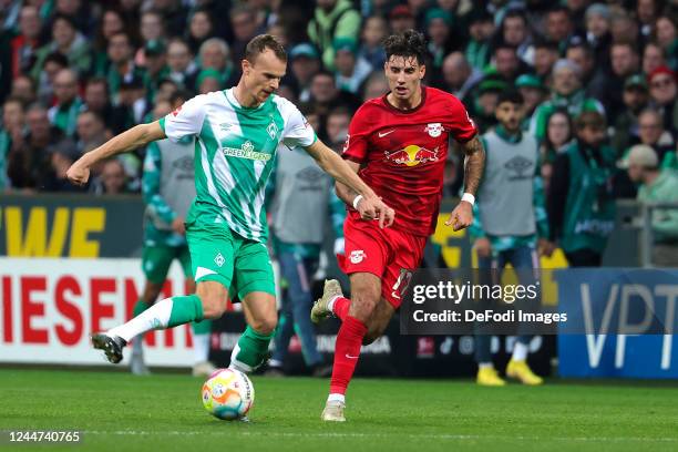 Christian Gross of SV Werder Bremen and Dominik Szoboszlai of RB Leipzig battle for the Ball during the Bundesliga match between SV Werder Bremen and...