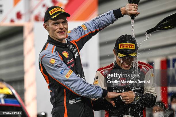 Second placed Ott Tanak of Estonia and Hyundai and third placed Takamto Katsuta of Japan and Toyota celebrate on the final podium during Day 4 of the...