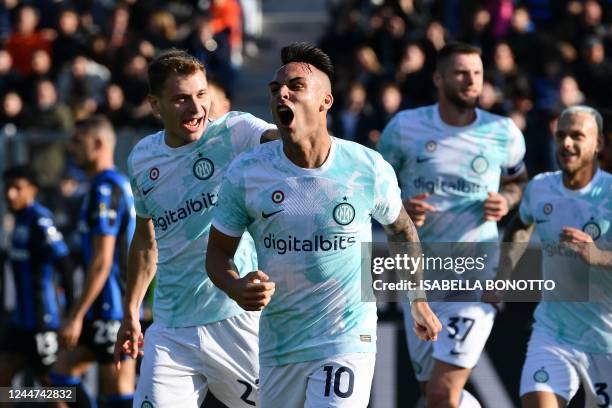 Inter Milan's Argentinian forward Lautaro Martinez celebrates after Atalanta scored an own goal during the Italian Serie A football match between...