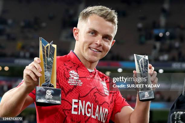 England's Sam Curran displays his trophies after the ICC men's Twenty20 World Cup 2022 Final between Pakistan and England at Melbourne Cricket Ground...