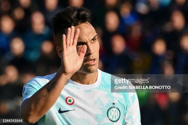 Inter Milan's Argentinian forward Lautaro Martinez waves as he leaves the pitch to be substituted during the Italian Serie A football match between...