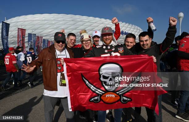 Supporters of Tampa Bay Buccaneers pose for a photo as they arrive prior to an American Football NFL match between the Seattle Seahawks and the Tampa...