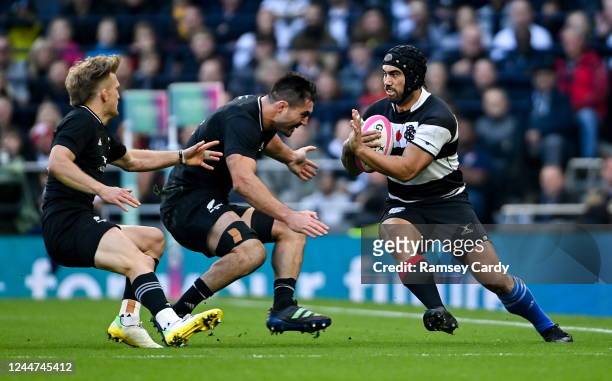 England , United Kingdom - 13 November 2022; Charlie Ngatai of Barbarians in action against Damian McKenzie, left, and Luke Jacobson of All Blacks XV...