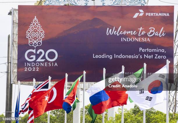 View of the flags of participant countries and a billboard for the 17th G20 Leaders' Summit in Bali's southern peninsula Nusa Dua, Indonesia on...