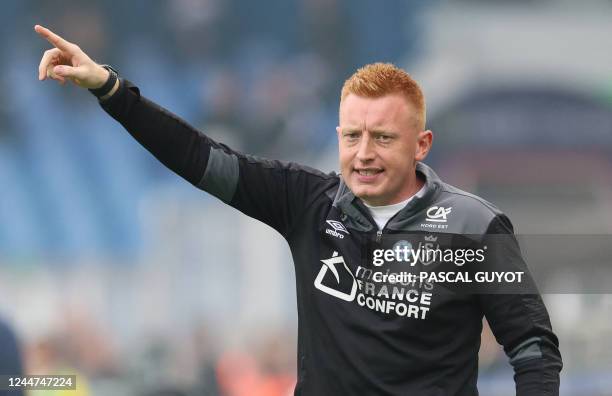 Reims' Belgian head coach William Still gestures to his players from the touchline during the French L1 football match between Montpellier Herault SC...