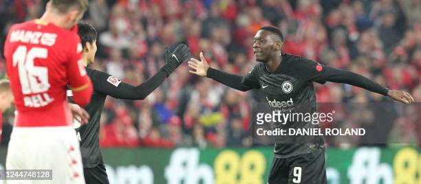 Frankfurt's French forward Randal Kolo Muani celebrates after scoring the 1-1 during the German first division Bundesliga football match between...