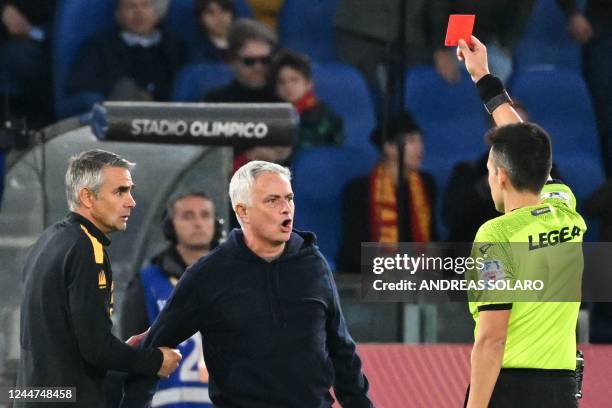 Italian referee Marco Di Bello gives a red card to AS Roma's Portuguese coach Jose Mourinho during the Italian Serie A football match between AS Rome...