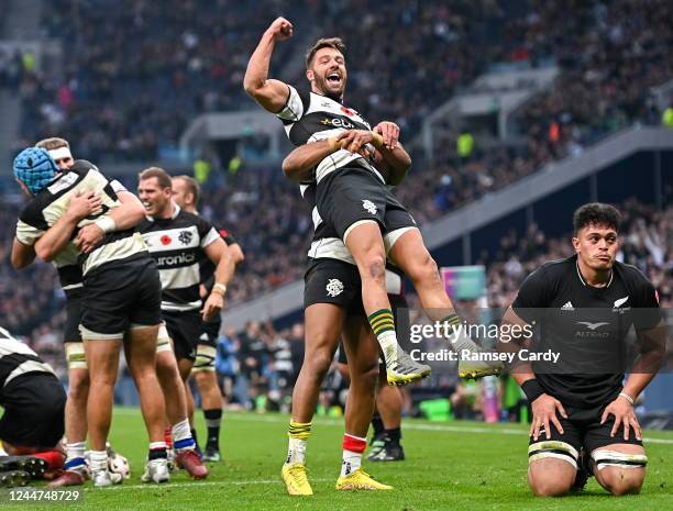 England , United Kingdom - 13 November 2022; Rhys Webb is lifted by Barbarians teammate Teddy Thomas at the final whistle of the Killik Cup match...