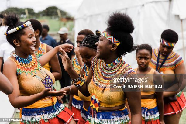 Two young women dancers share a light moment during the Ingoma Dance Festival organised by Ubunye Bama Hostela at the Glebelands Hostel in Umlazi...