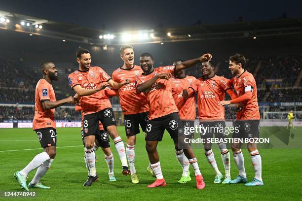 Lorient's Nigerian forward Terem Moffi celebrates after scoring a goal with team mates Congolese forward Gedeon Kalulu, Tunisian defender Montassar...