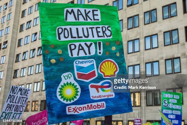 Climate justice campaigners march from the Shell Centre to Trafalgar Square to demand urgent climate finance and reparations for loss and damage for...