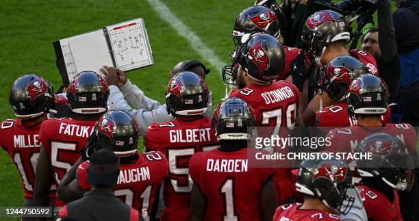 Team members of Tampa Bay Buccaneers stand together prior to an American Football NFL match between the Seattle Seahawks and the Tampa Bay Buccaneers...
