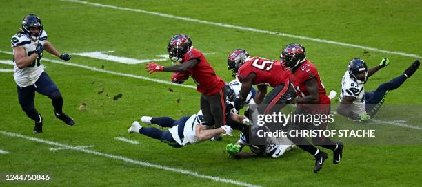 Players vie for the football during an American Football NFL match between the Seattle Seahawks and the Tampa Bay Buccaneers at the Allianz Arena...