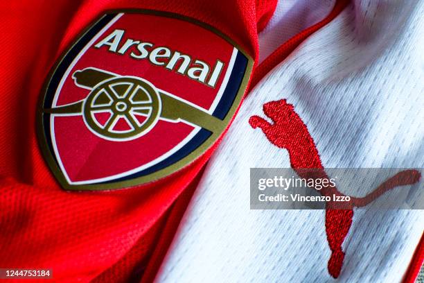 In this photo illustration a English Arsenal team logo sewn on a red jersey. Famous team of the British league founded by David Danskin, it is one of...