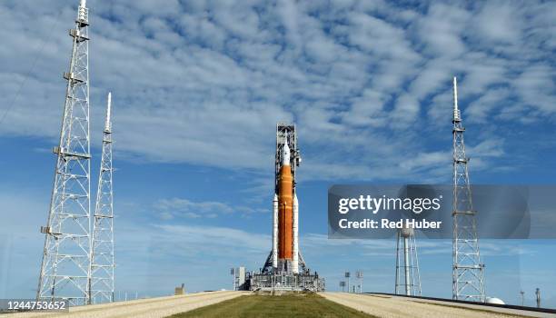 The Artemis 1 moon rocket and the Orion spacecraft sit poised on Launch Pad 39B November 13, 2022 as the countdown for the third launch attempt...