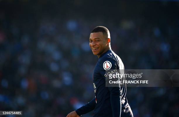 Paris Saint-Germain's French forward Kylian Mbappe smiles during the French L1 football match between Paris Saint-Germain FC and AJ Auxerre at the...