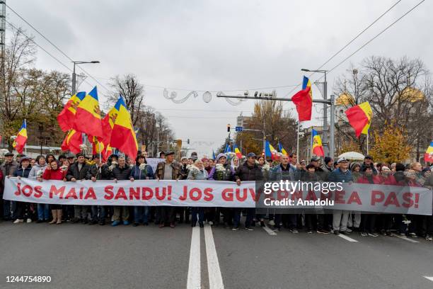 Several thousand protesters calling Moldova's pro-Western leaders to leave the high office march toward the Constitutional Court for the ninth...