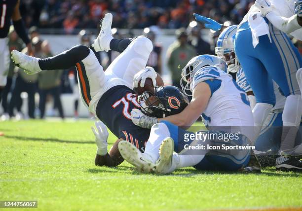 Detroit Lions defensive end Aidan Hutchinson tackles Chicago Bears running back David Montgomery during a game between the Detroit Lions and the...