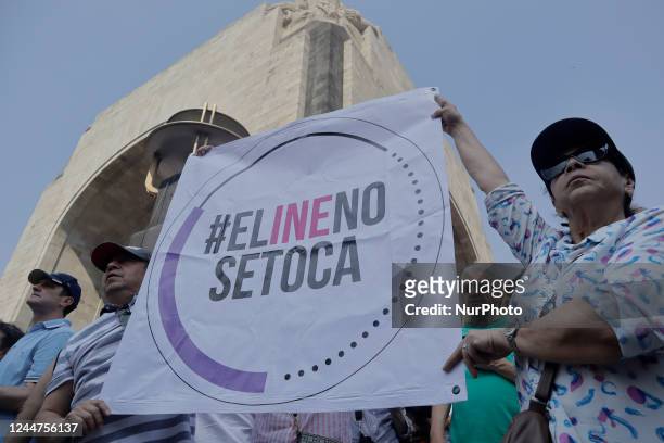 Two people hold a banner on the esplanade of the Monument to the Revolution in Mexico City, where various organizations, businessmen and people show...