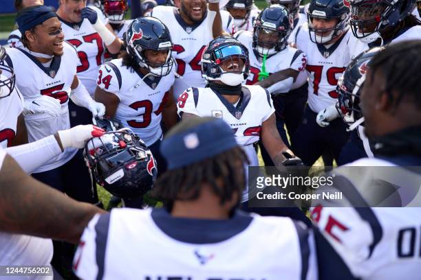 Christian Kirksey of the Houston Texans leads the team huddle before kickoff against the New York Giants at MetLife Stadium on November 13, 2022 in...