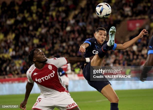 Marseille's Moroccan midfielder Amine Harit fights for the ball with Monaco's French defender Axel Disasi during the French L1 football match between...