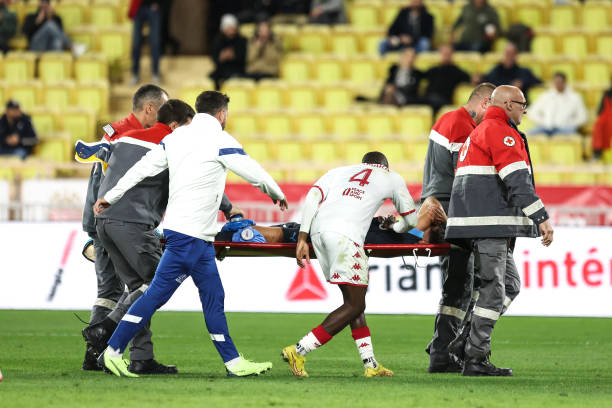 Axel DISASI of Monaco and Amine HARIT of Marseille is injured during the Ligue 1 Uber Eats match between Monaco and Marseille at Stade Louis II on...