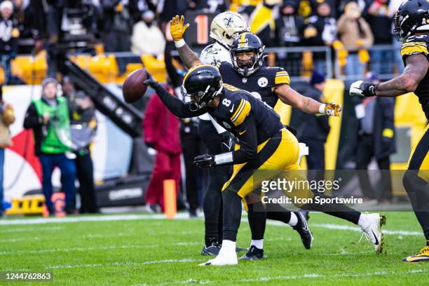 Pittsburgh Steelers quarterback Kenny Pickett spikes the ball after scoring a touchdown during the national football league game between the New...