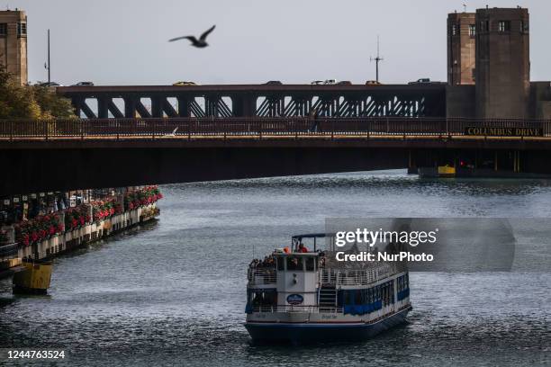 Bright Star ferry and Columbus Drive Bridge over Chicago River in Chicago, Illinois, United States, on October 14, 2022.