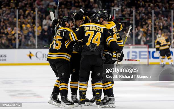 Connor Clifton of the Boston Bruins celebrates his goal against the Vancouver Canucks with teammates Taylor Hall, Hampus Lindholm David Krejci and...