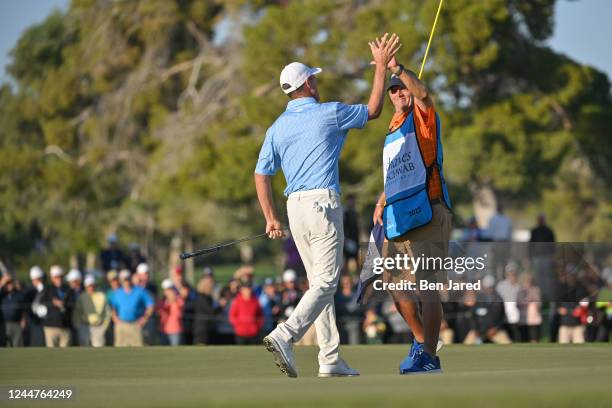 Steven Alker of New Zealand high fives his caddie on the 18th green after winning the Charles Schwab Cup during the final round of the PGA TOUR...