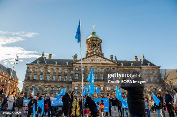 Uyghur people raise the Uyghur flag in the middle of the square during an event to commemorate the 'National Day of East Turkistan'. November 12th...